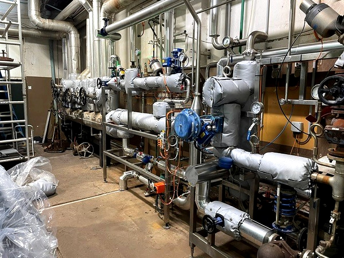Full thermal jacket scope across multiple levels of valves, actuators, and pipe fittings in an industrial process area